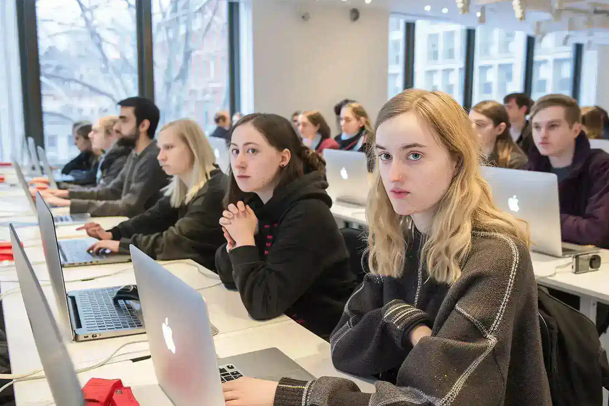 OpenAI collaborates with universities to research AI ethics and societal impacts.